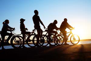Group cycling in the sunset