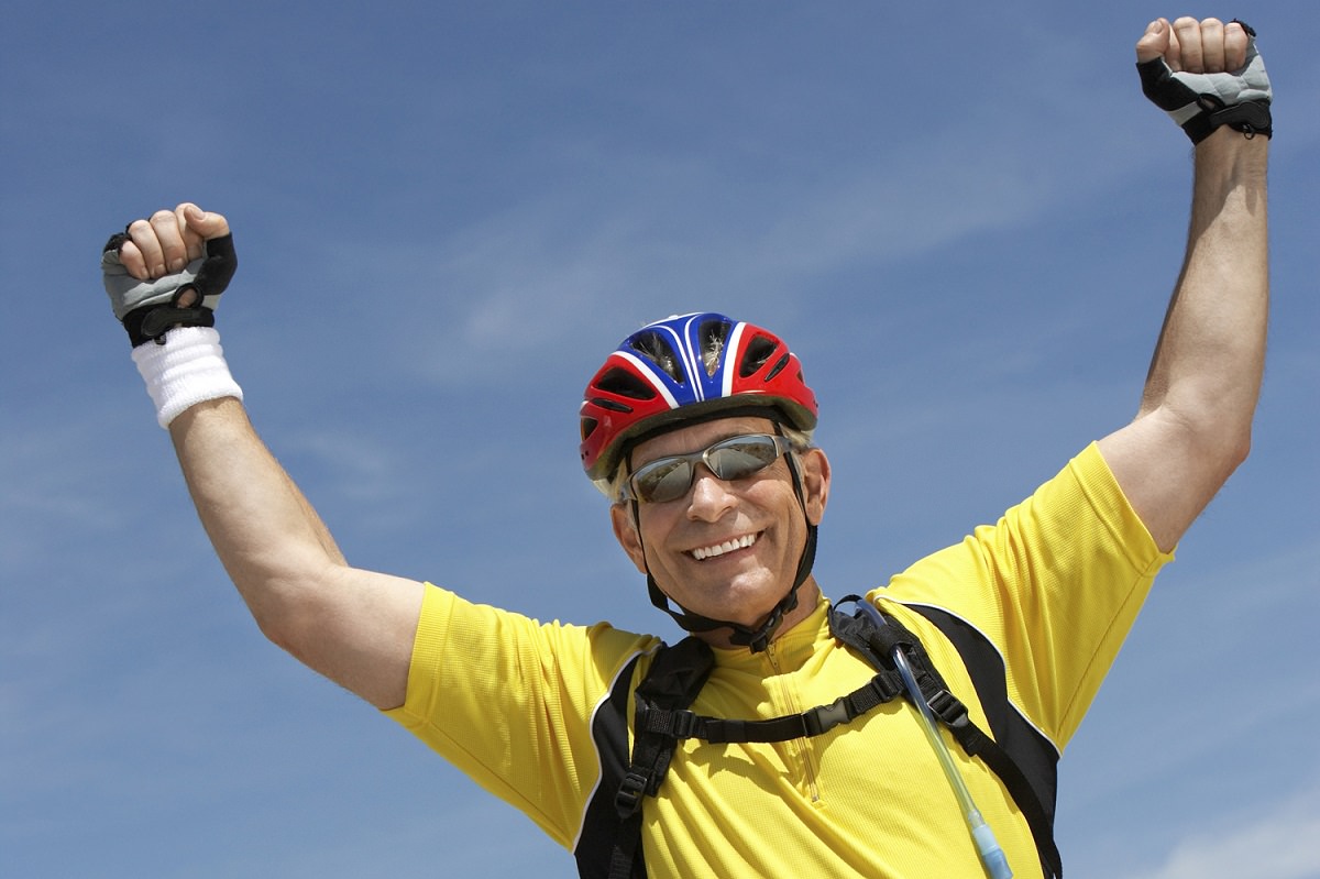 Man celebrating cycling victory