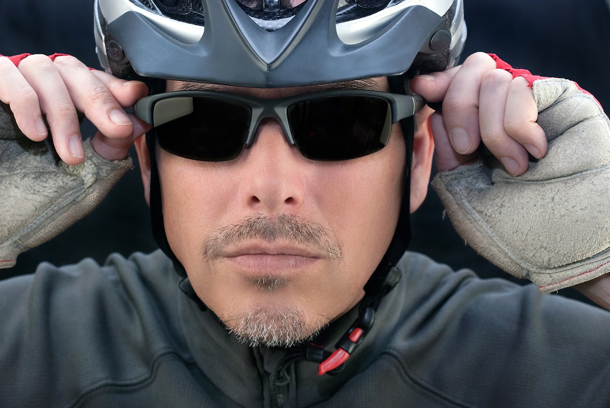 Cool cyclist with helmet and glasses