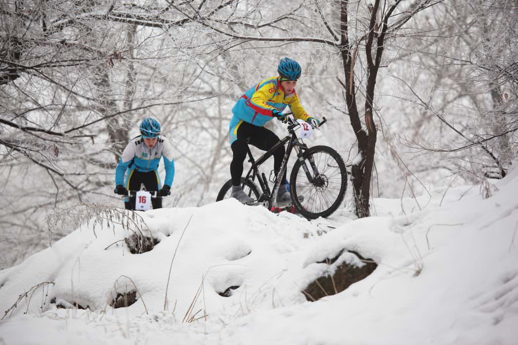 Winter cyclists in snow