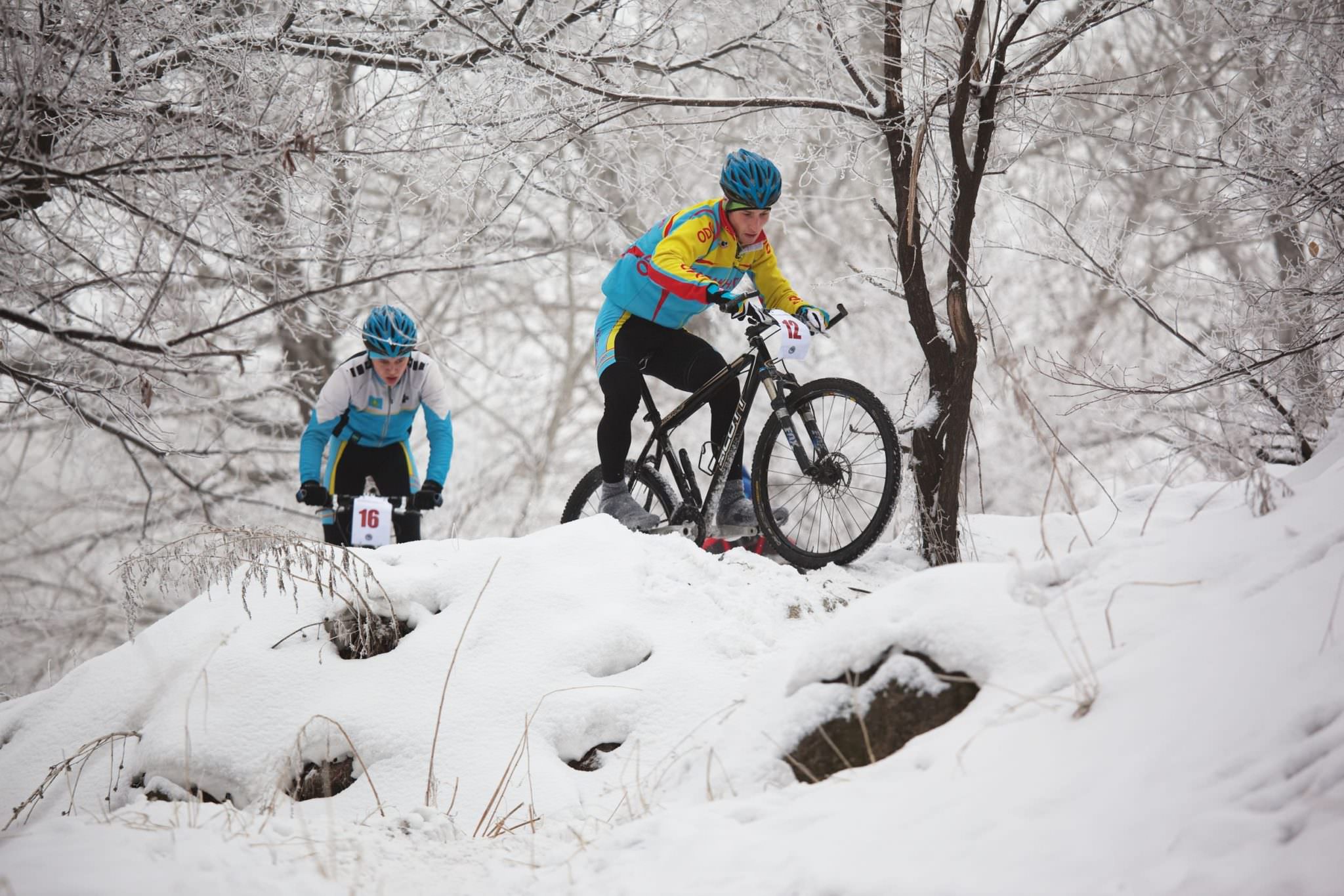 Winter cyclists in snow
