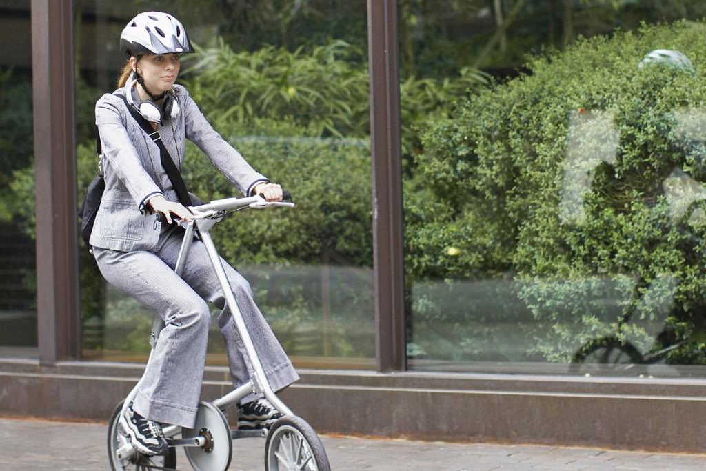 Fashion woman on folding bike