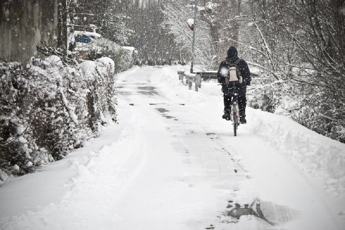 Biking with snowfall around