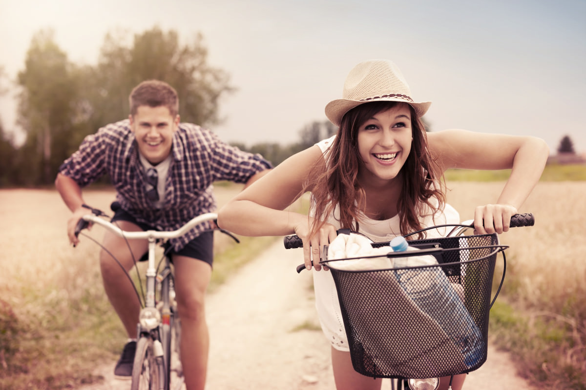 Couples racing on their bikes