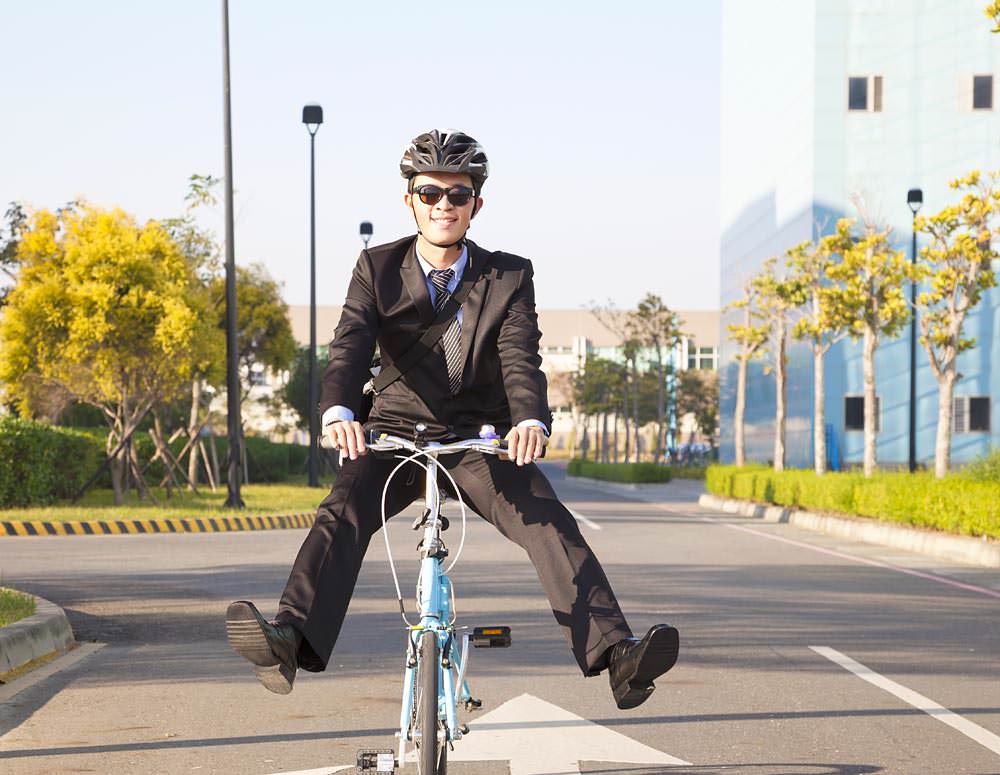 Man riding cycle to office