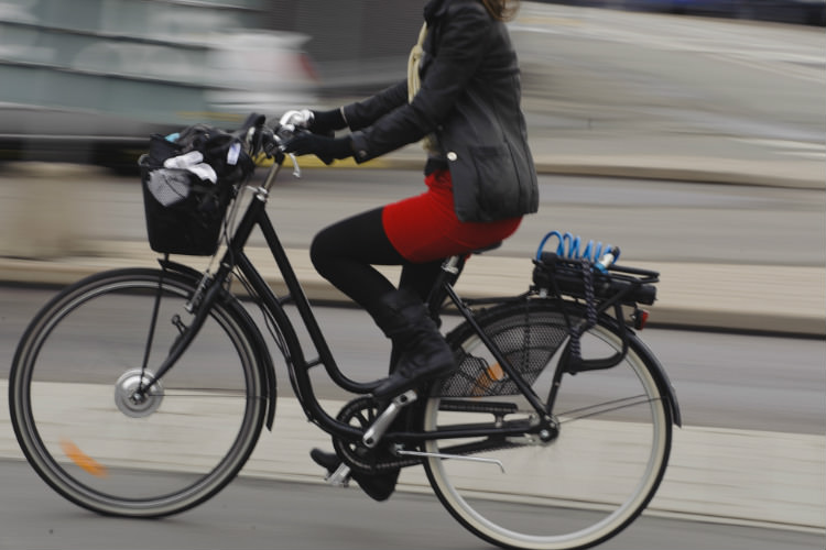 Female biker riding in city