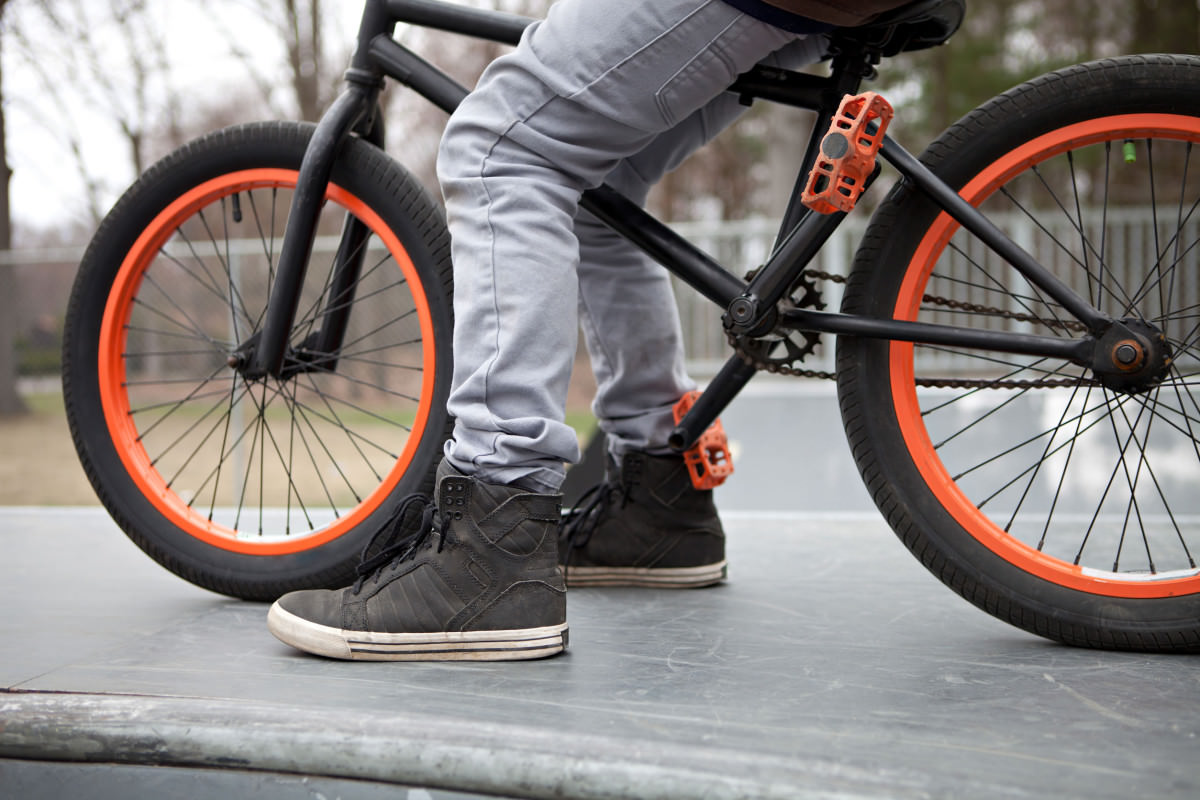 BMX bike rider parked