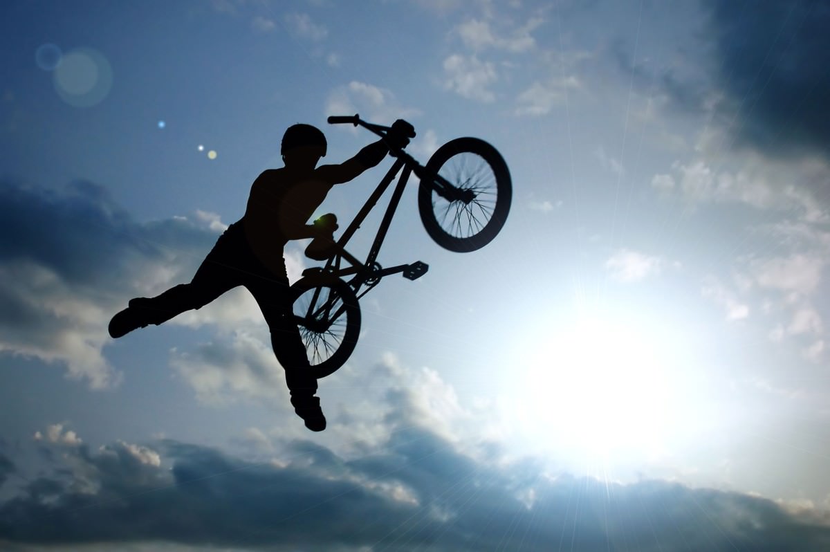 BMX bike jumping in air