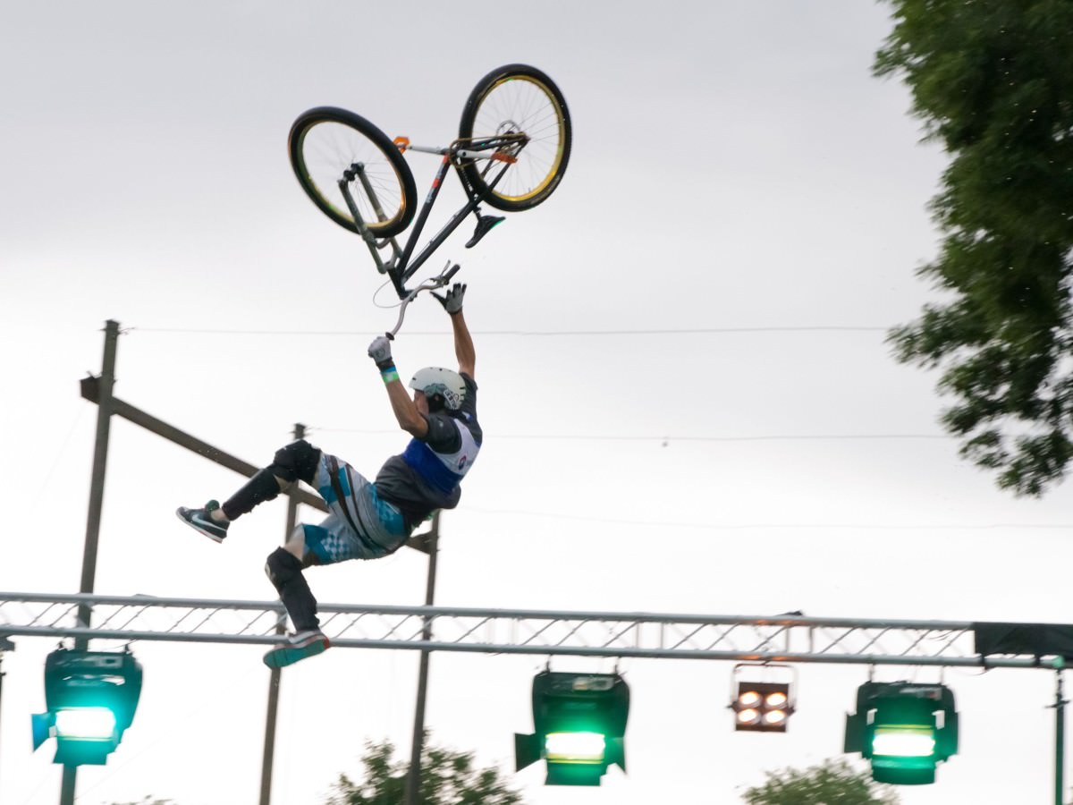 Hanging from the bike after a jump