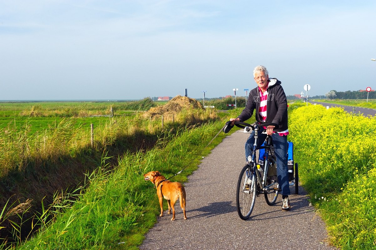 Man on bike with dog