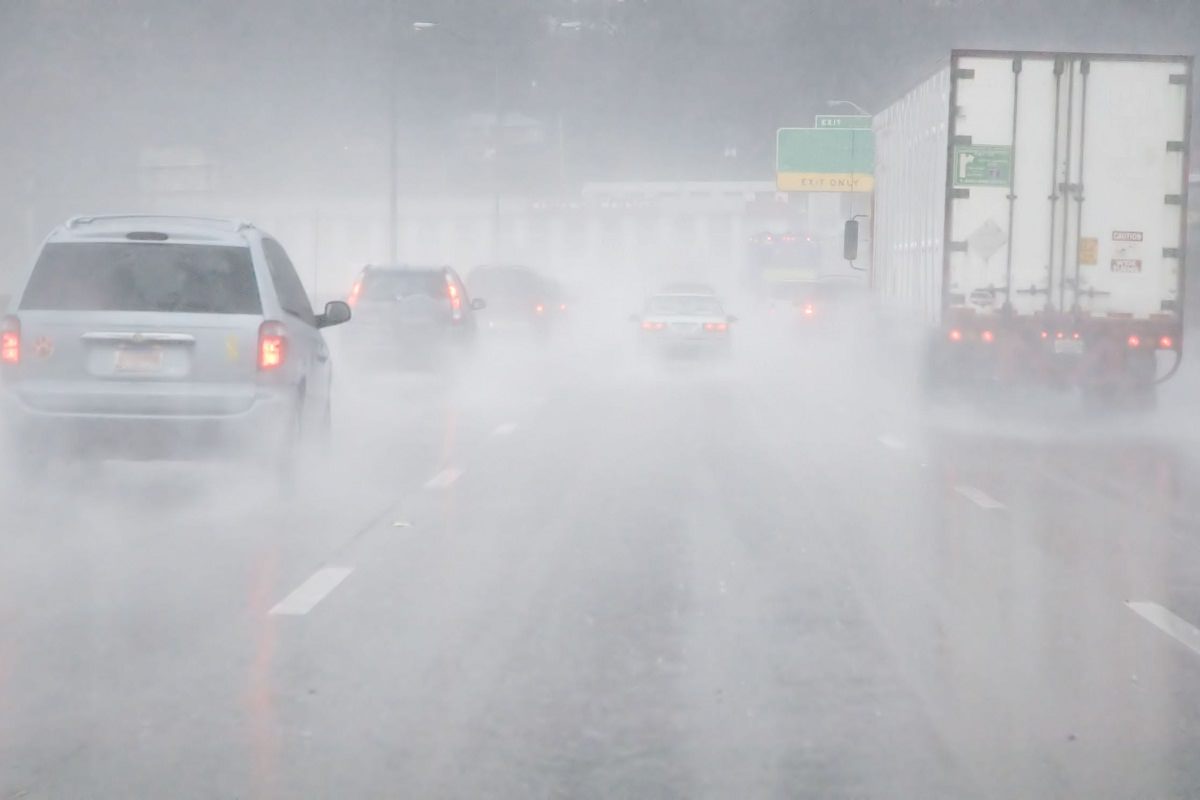 Vehicles on road in rainy weathe