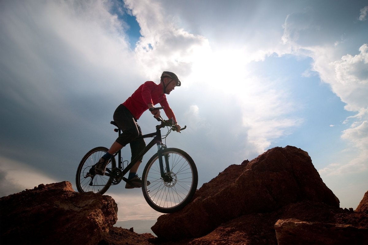 Rider biking in rocky terrain