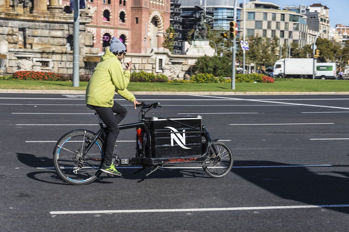 Person riding his bike with cargo box in front