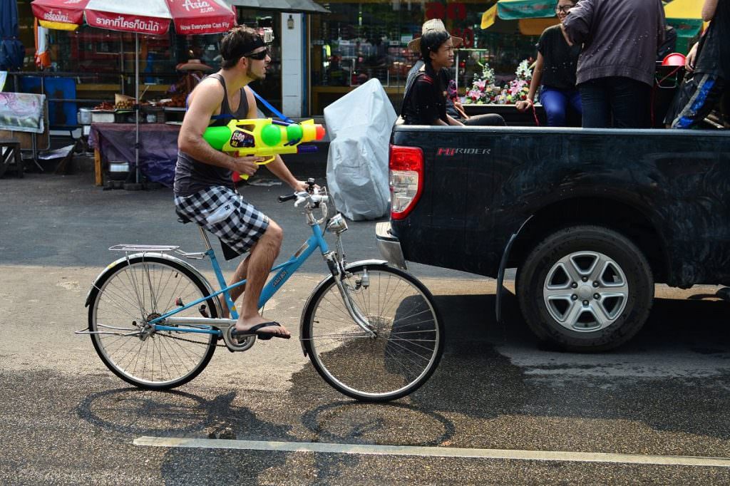 Cyclist with water gun