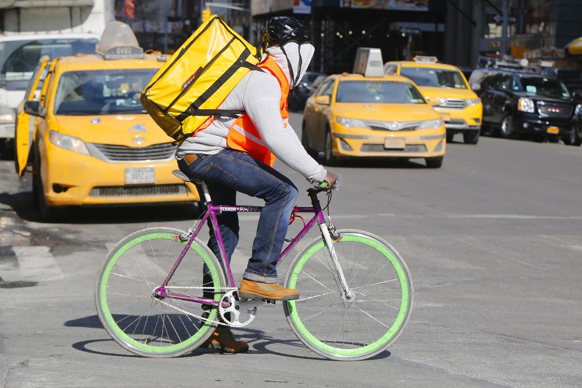 Courier delivery man on his bicycle