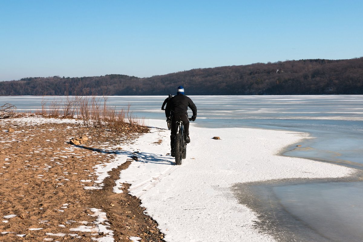 Riding fat tire bikes next to a frozen lake