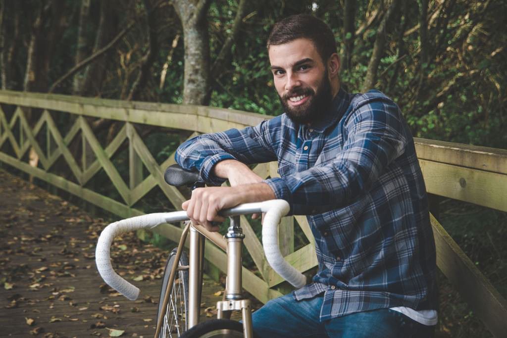 Man with a fixie bike in park