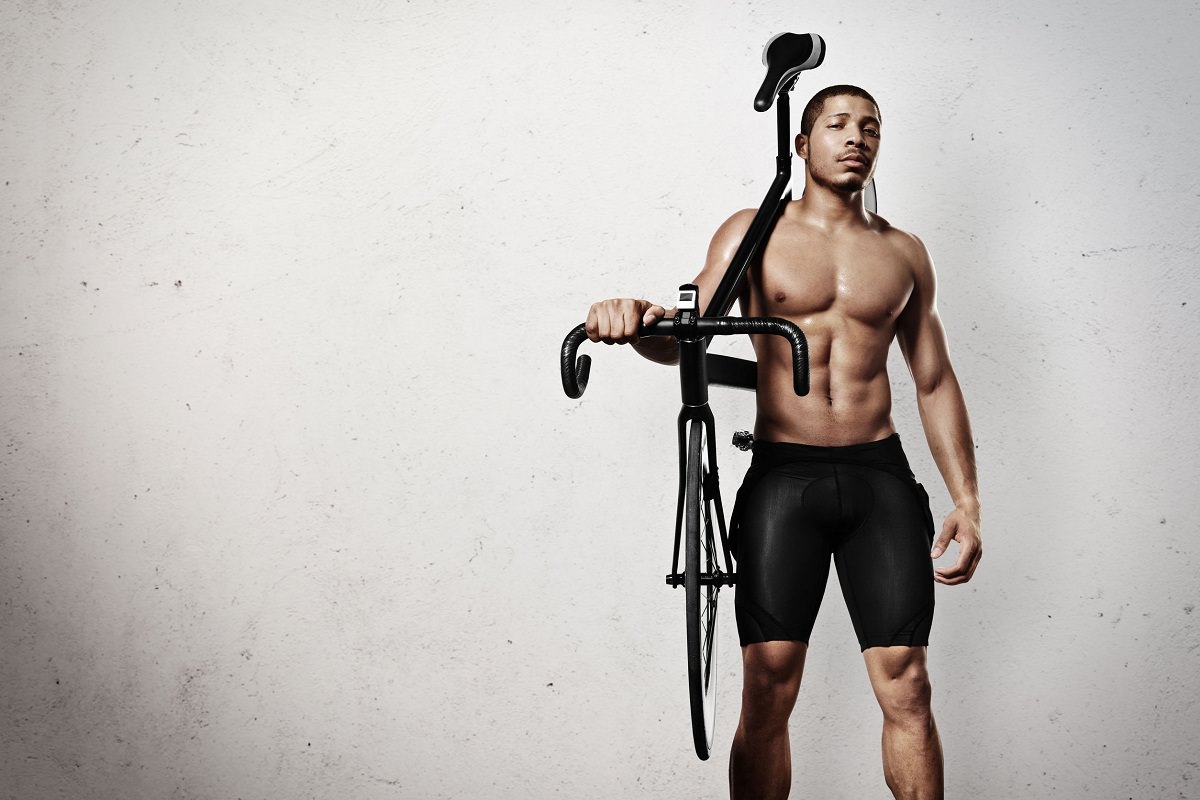 Athelete with bicycle on shoulder