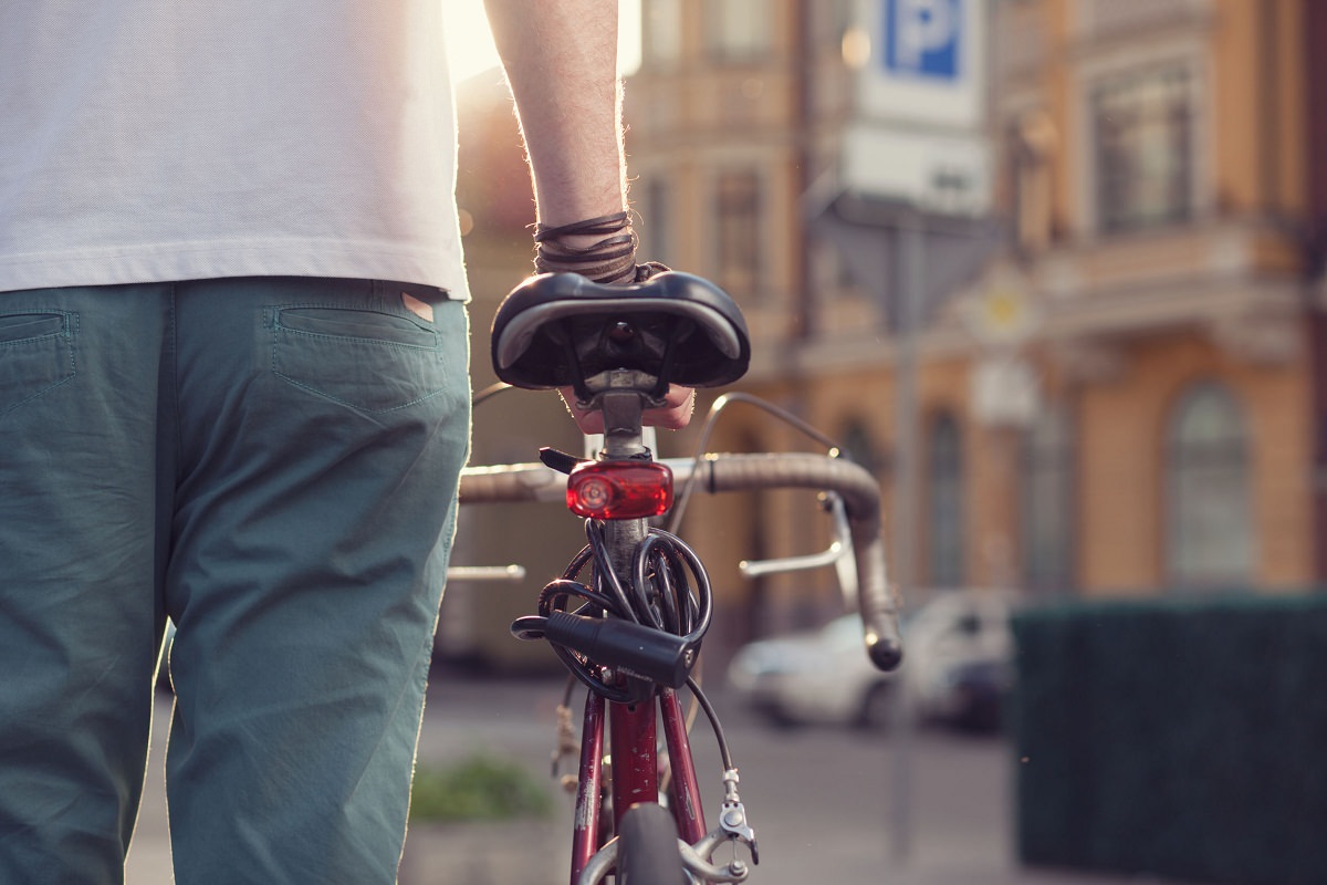 Biker with vintage race bike