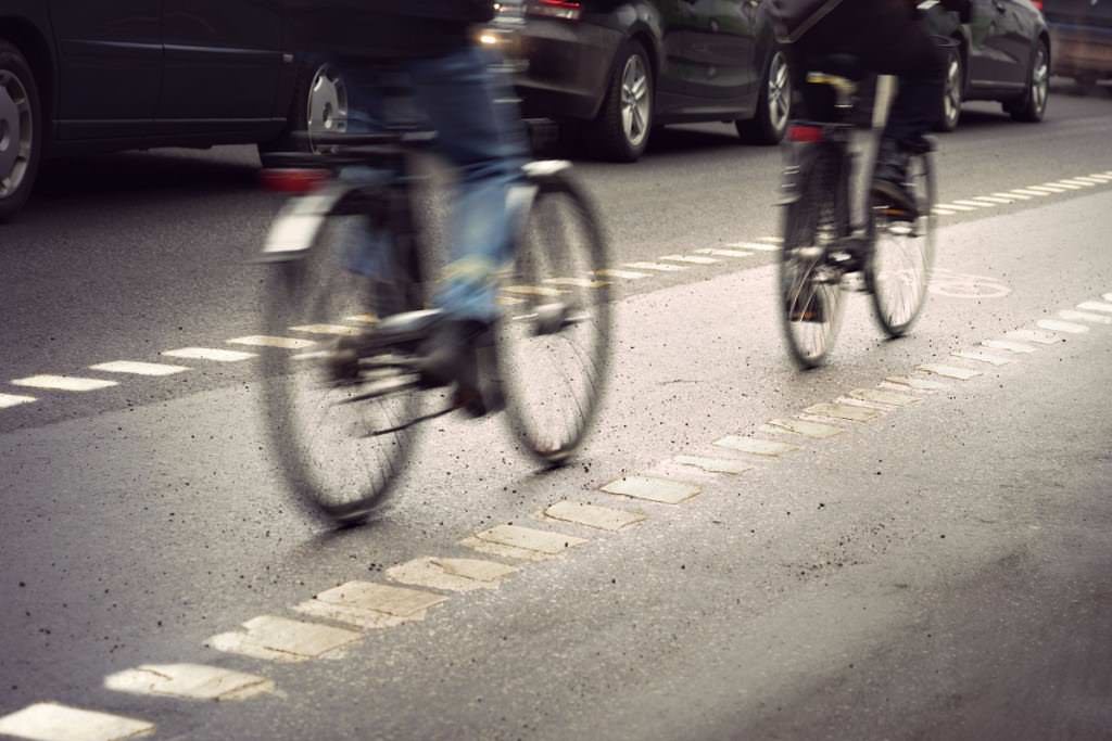 Cyclists biking in bike lane