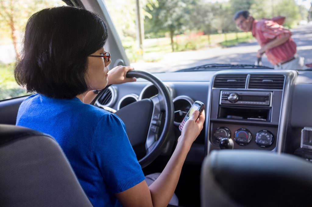 Distracted driver hitting a pedestrian