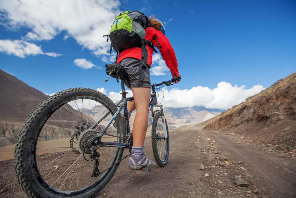 Medic cycling on a mountain bike