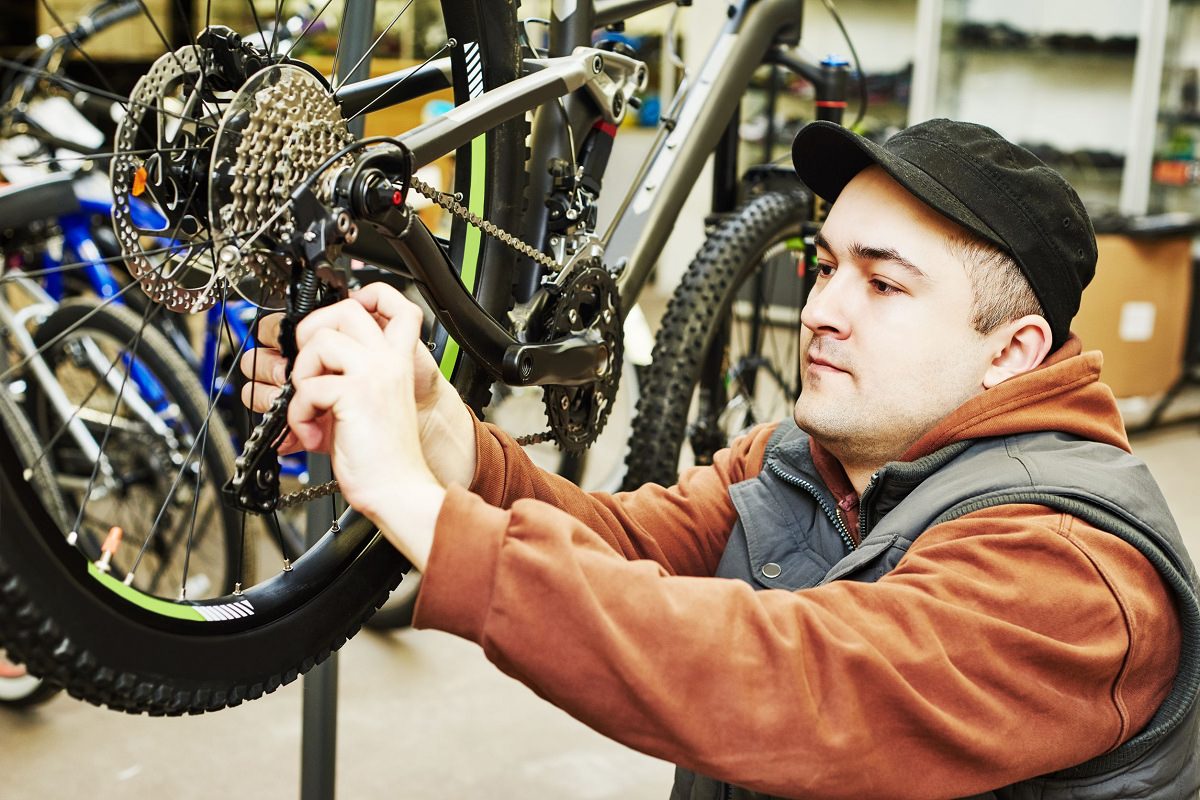 Mechanic installing bike gear