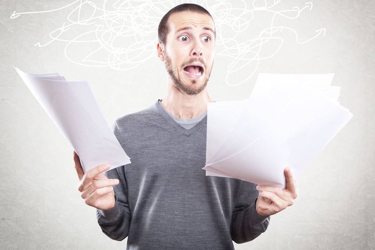 Man looking at scary papers