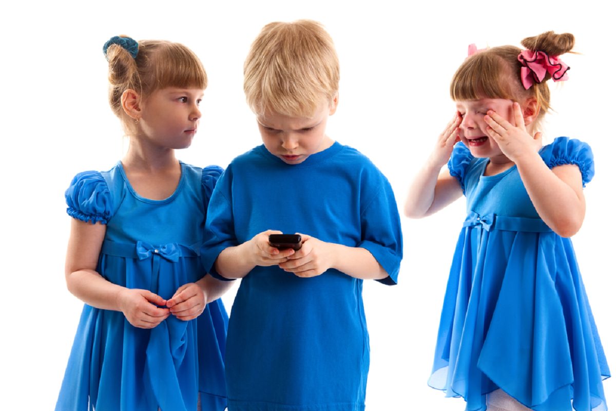 Children fighting on a phone