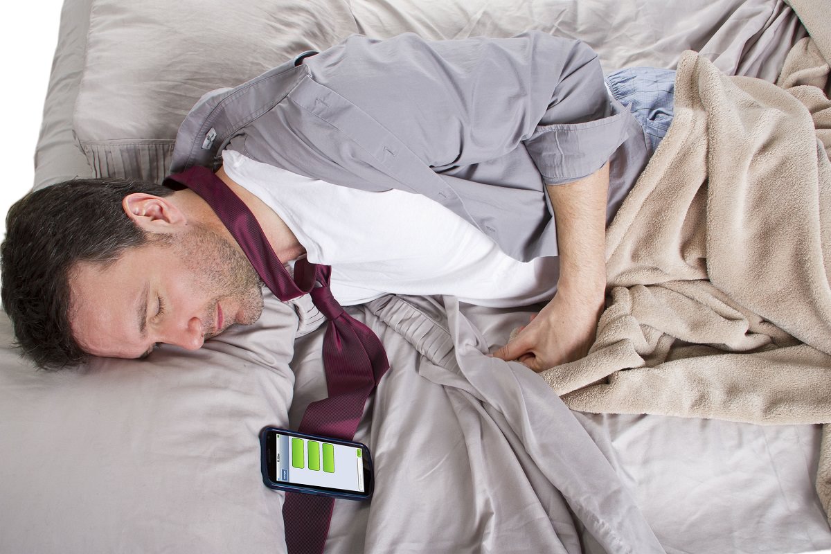 Man sleeping wearing office clothes