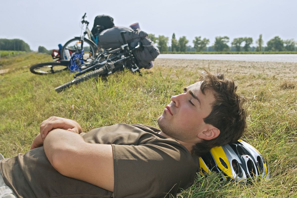 Cyclist resting with eyes closed