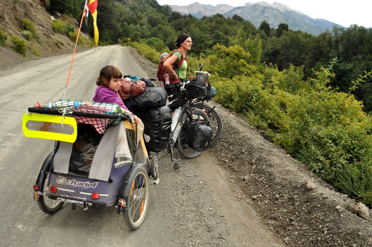 Maïa in the bike trailer and Unia on the back