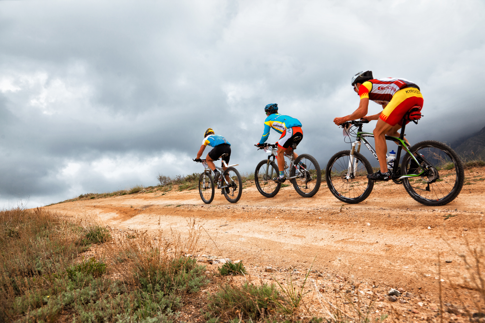 3 cyclists on mountain bikes