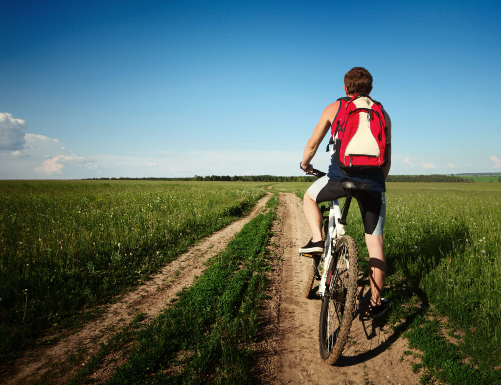 standing on a mountain bike