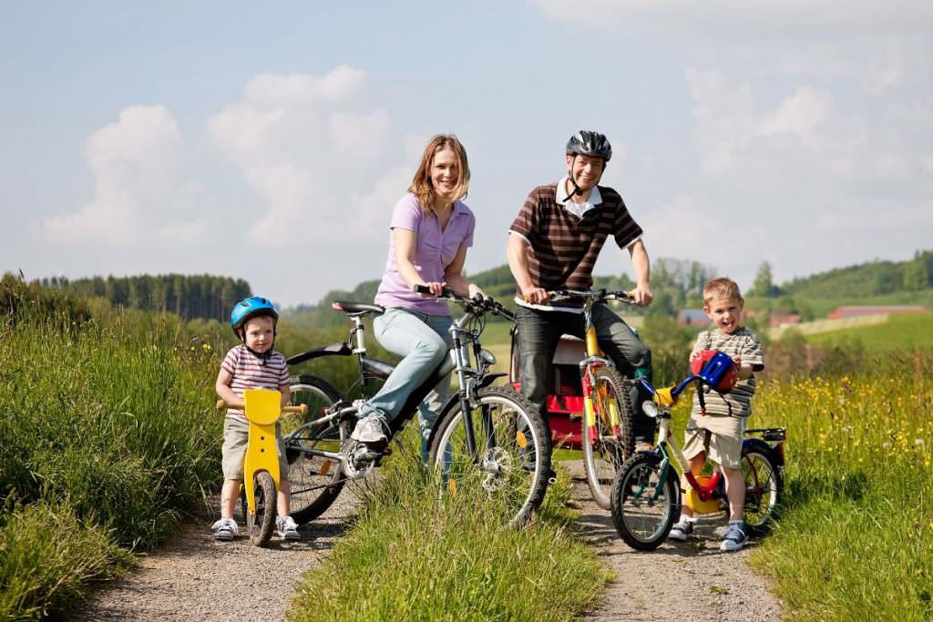 Family with bike trailer and kids