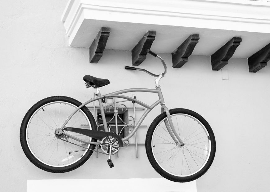 Bike Hanging On White Wall