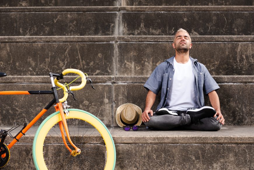 Man Meditating With Bike