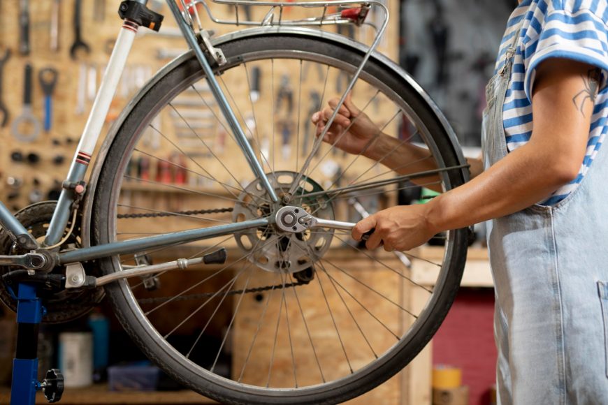 Worker Repairing Bike
