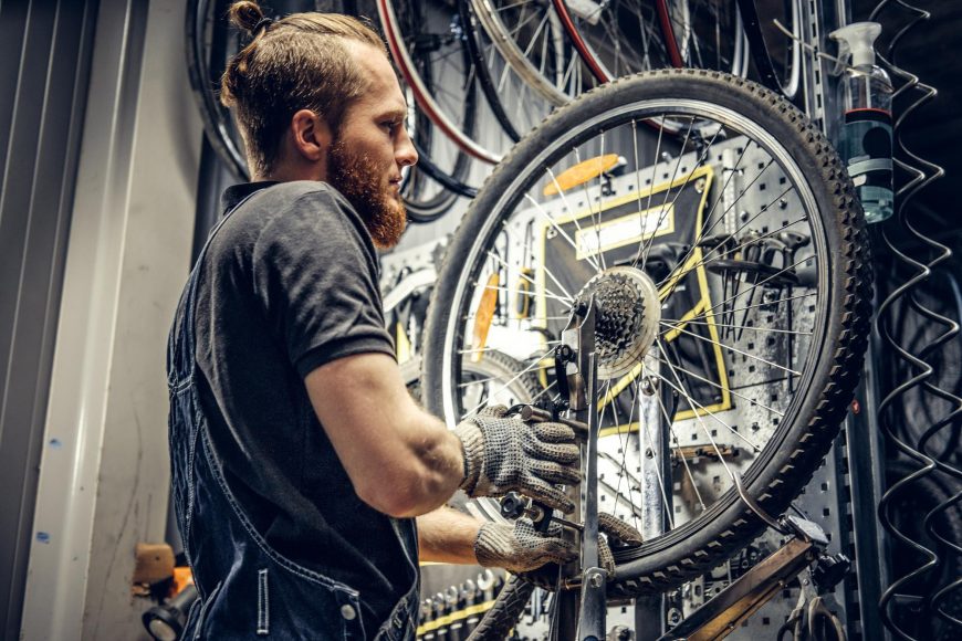 Mechanic Removing Bicycle Rear Cassette