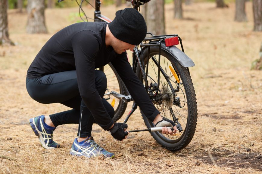 Cyclist Fixing Flat Tire