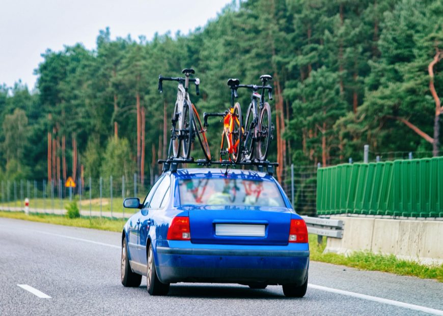 Car With Bicycles Mounted On Roof Rack