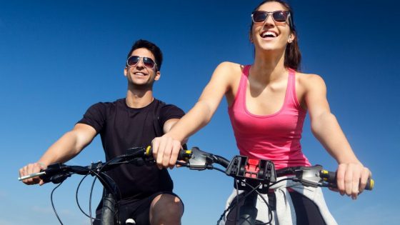 Happy Couple Enjoying Bike Riding