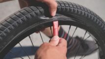 Mechanic Removes Bike Tire From Wheel