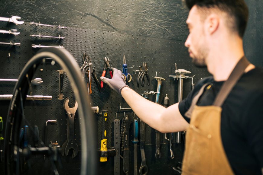 Mechanic Repairing Bicycle