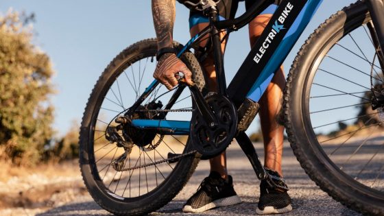 Cyclist Fixing The Bike Pedal