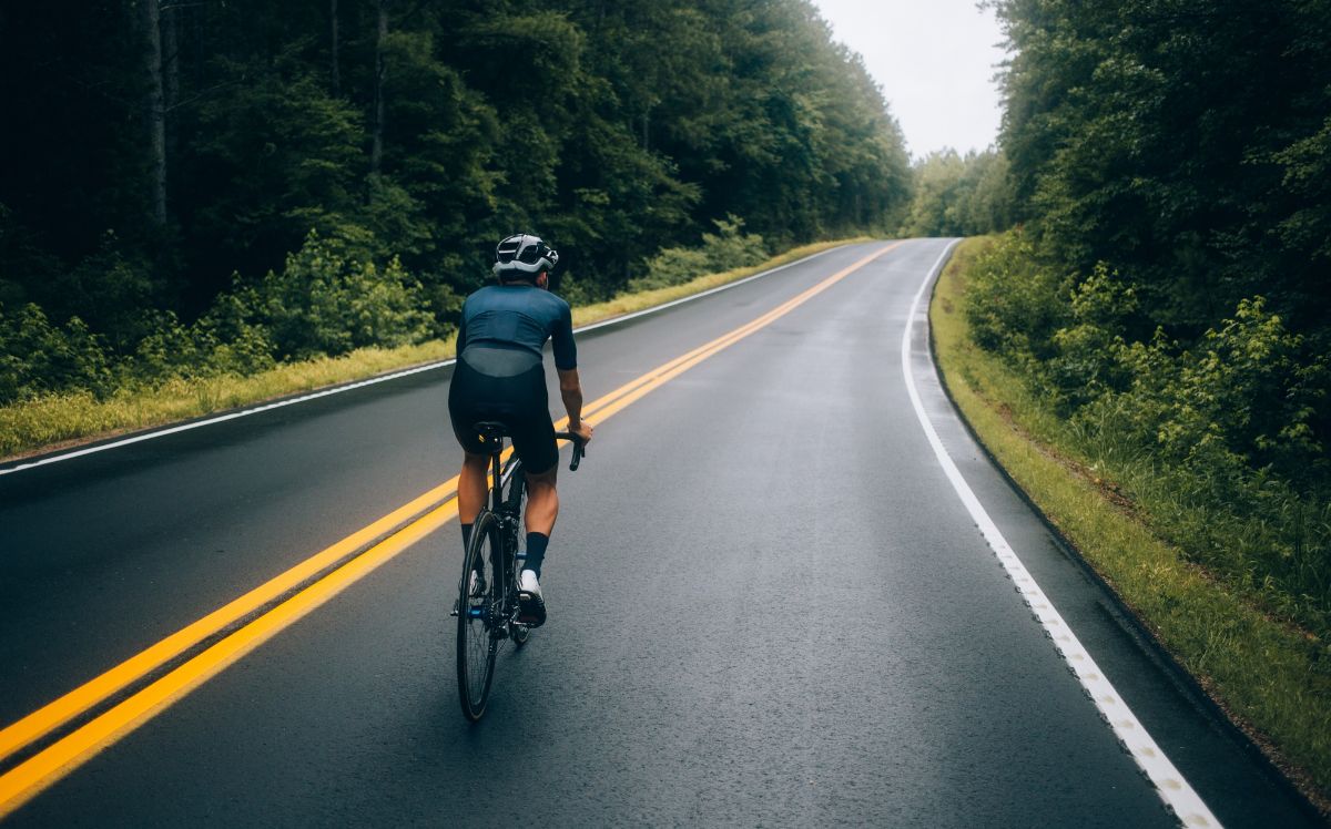 Cyclist Man Riding A Bike On The Road