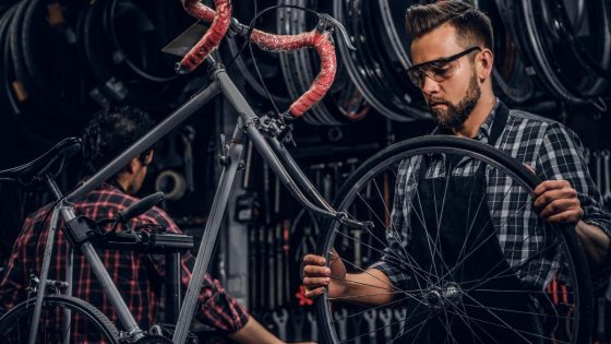 Mechanic Installing Replacing A Bike Tire