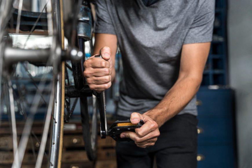 Mechanic Repairing Bike Pedal