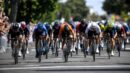 Generic road cyclists sprinting toward a finish line
