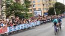Three riders racing past crowds during the 2026 Giro d'Italia